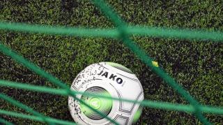 Valokuva jalkapallosta maalissa